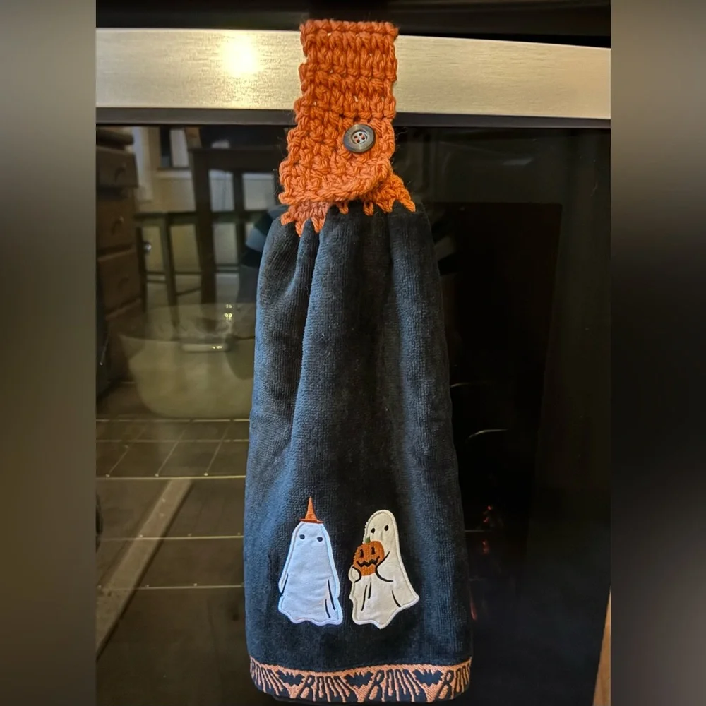 Hand crocheted full towel with embroidered ghosts